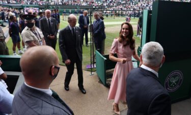 Kate leaves Centre Court at Wimbledon during finals weekend.