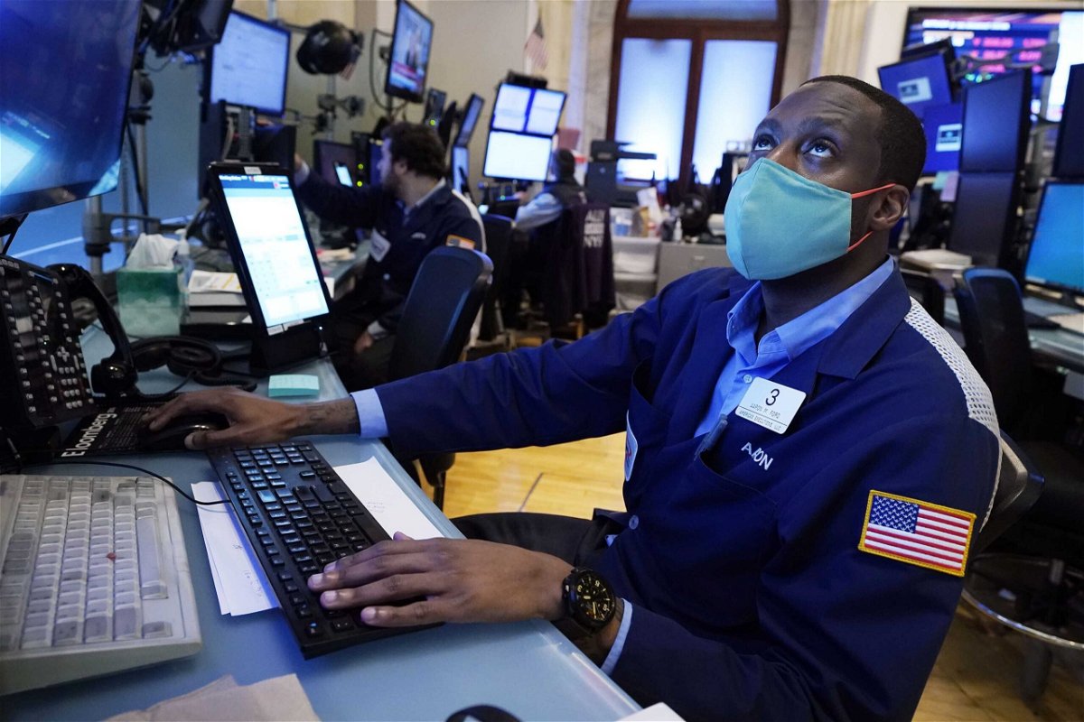 <i>Richard Drew/AP</i><br/>Trader Aaron Ford works on the floor of the New York Stock Exchange on July 19.  Wall Street opened higher July 20