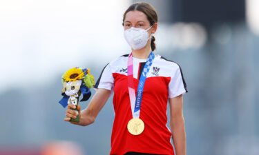 Anna Kiesenhofer of Team Austria poses with the gold medal after day two of the Tokyo 2020 Olympic Games at Fuji International Speedway on July 25 in Oyama