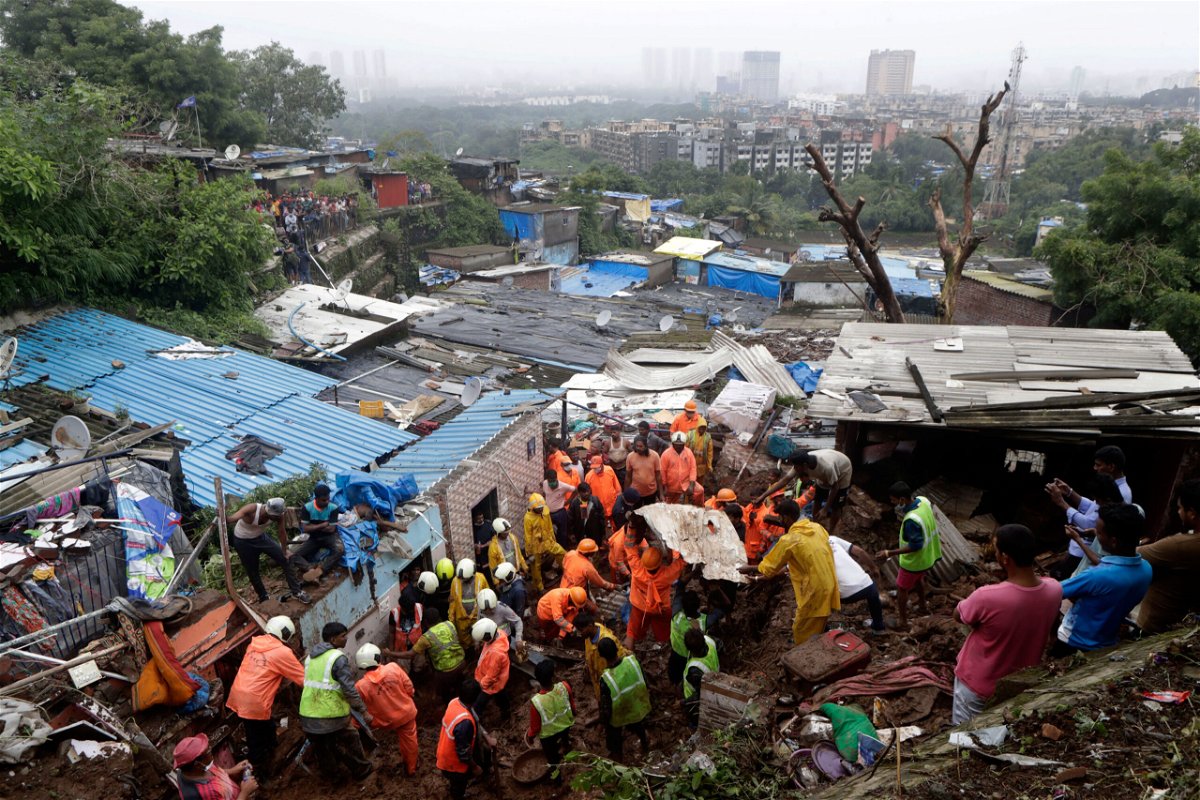 <i>Rajanish Kakade/AP</i><br/>At least 31 people were killed when torrential rain swept through India's financial capital late on July 18