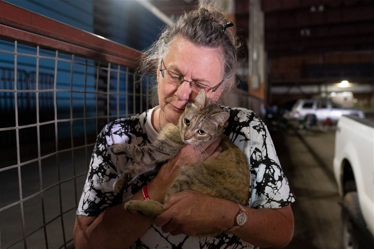 <i>Nathan Howard/AP</i><br/>Dee McCarley hugs her cat Bunny