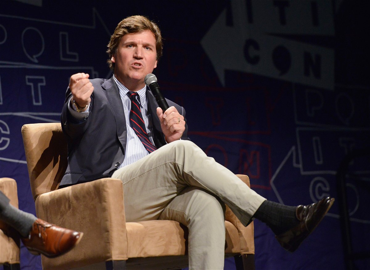 <i>Chelsea Guglielmino/Getty Images</i><br/>Political commentator Tucker Carlson speaks during Politicon 2018 at Los Angeles Convention Center on October 21
