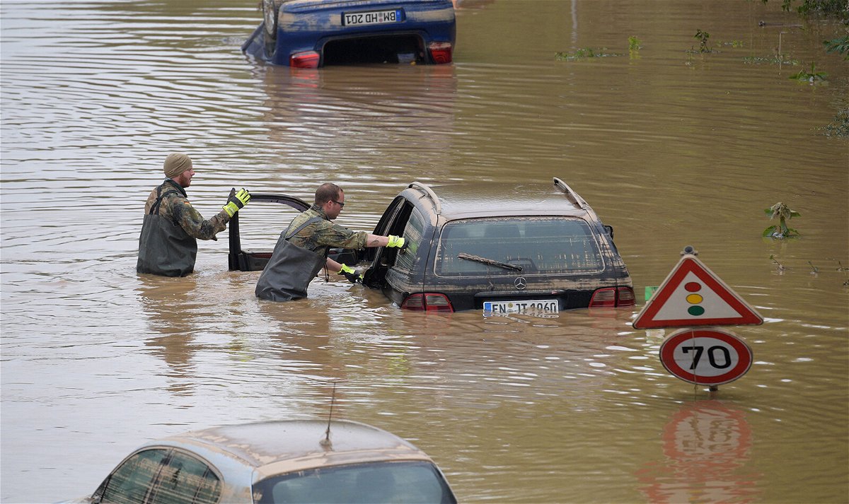 <i>Sebastien Bozon/AFP/Getty Images</i><br/>Soldiers of the German armed forces Bundeswehr search for flood victims in submerged vehicles on the federal highway B265 in Erftstadt