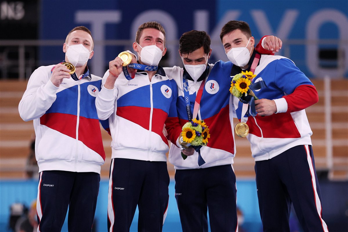 <i>Jamie Squire/Getty Images</i><br/>Gymnasts from Team ROC pose with the gold medal after winning the Men's Team Final on day three of the Tokyo Olympic Games.