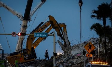 Search and rescue teams continue to work in the rubble at the site of the collapsed Champlain Towers South condo in Surfside