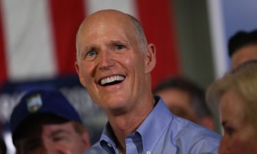 Rick Scott addresses the crowd as he attends a Get out the Vote Rally at AmeriKooler on November 05