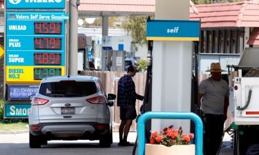 A customer prepares to pump gasoline into his car at a Valero station on July 12 in Mill Valley