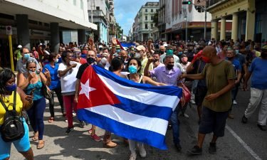 People take part in a demonstration to support the government of the Cuban President Miguel Diaz-Canel in Havana