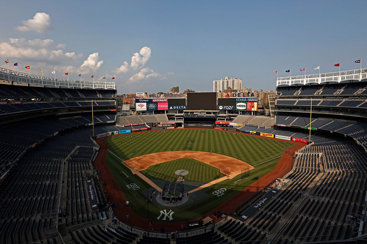 <i>Adam Hunger/Getty Images</i><br/>Members of the Boston Red Sox take batting practice at Yankee Stadium on July 15 in New York City. The game was postponed due to positive Covid-19 tests within the Yankee organization.