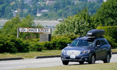 A car heads into the U.S. from Canada at the Peace Arch border crossing Tuesday