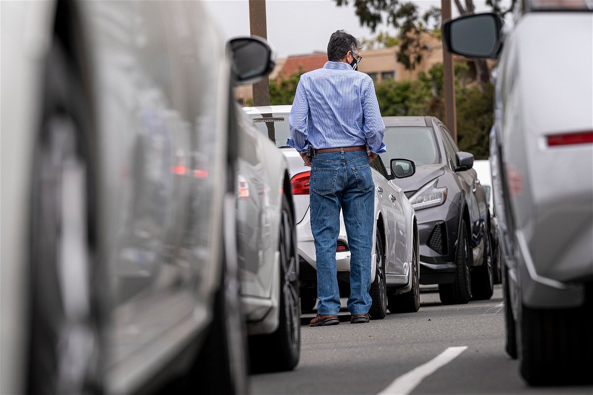 <i>David Paul Morris/Bloomberg/Getty Images</i><br/>A customer shops for vehicles at a car dealership in Richmond