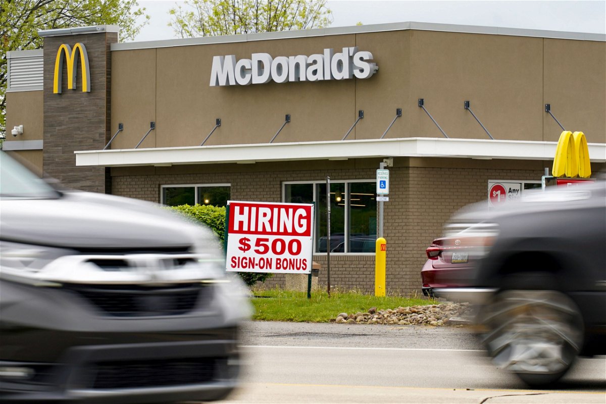 <i>Keith Srakocic/AP</i><br/>Hourly earnings are rising. A hiring sign offers a $500 bonus outside a McDonalds restaurant