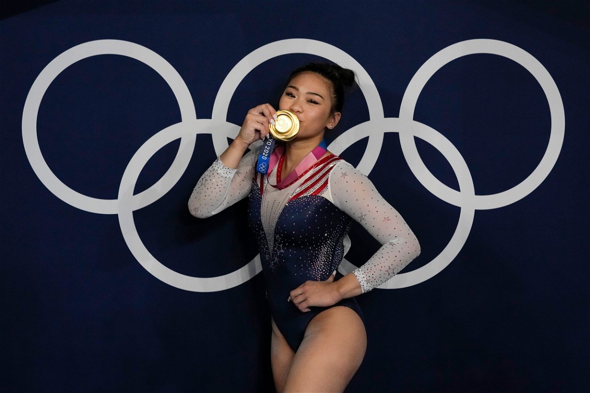 <i>Gregory Bull/AP</i><br/>Suni Lee reacts as she poses for a picture after winning the gold medal in the artistic gymnastics women's all-around final on July 29 in Tokyo