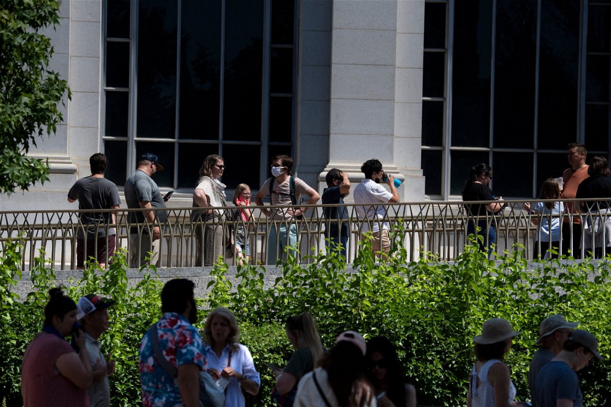 <i>Brendan Smialowski/AFP/Getty Images</i><br/>People wait in line to enter the Smithsonian's Natural History Museum as the DC area experiences a heatwave on June 30