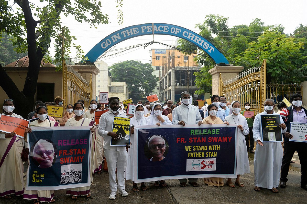 <i>Noah Seelam/AFP/Getty Images</i><br/>Catholic priests and nuns protest against the arrest of Stan Swamy in the eastern Indian state of Jharkhand on October 21