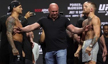 Dustin Poirier and Conor McGregor pose during a ceremonial weigh in for UFC 264 at T-Mobile Arena on July 9 in Las Vegas.