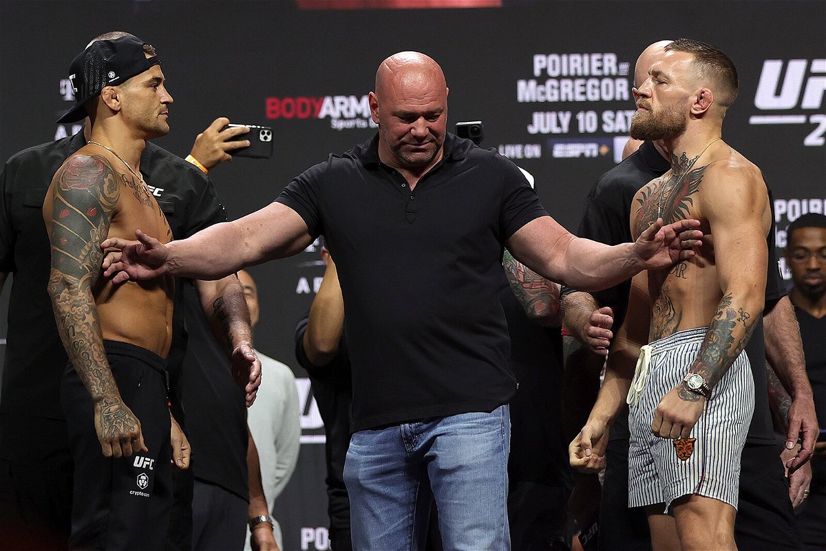 <i>Stacy Revere/Getty Images</i><br/>Dustin Poirier and Conor McGregor pose during a ceremonial weigh in for UFC 264 at T-Mobile Arena on July 9 in Las Vegas.