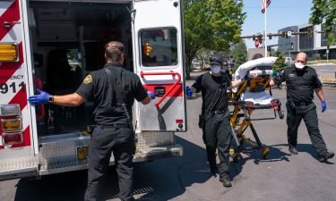 Salem Fire Department paramedics and employees of Falck Northwest ambulances respond to a heat exposure call during a heat wave on June 26 in Salem