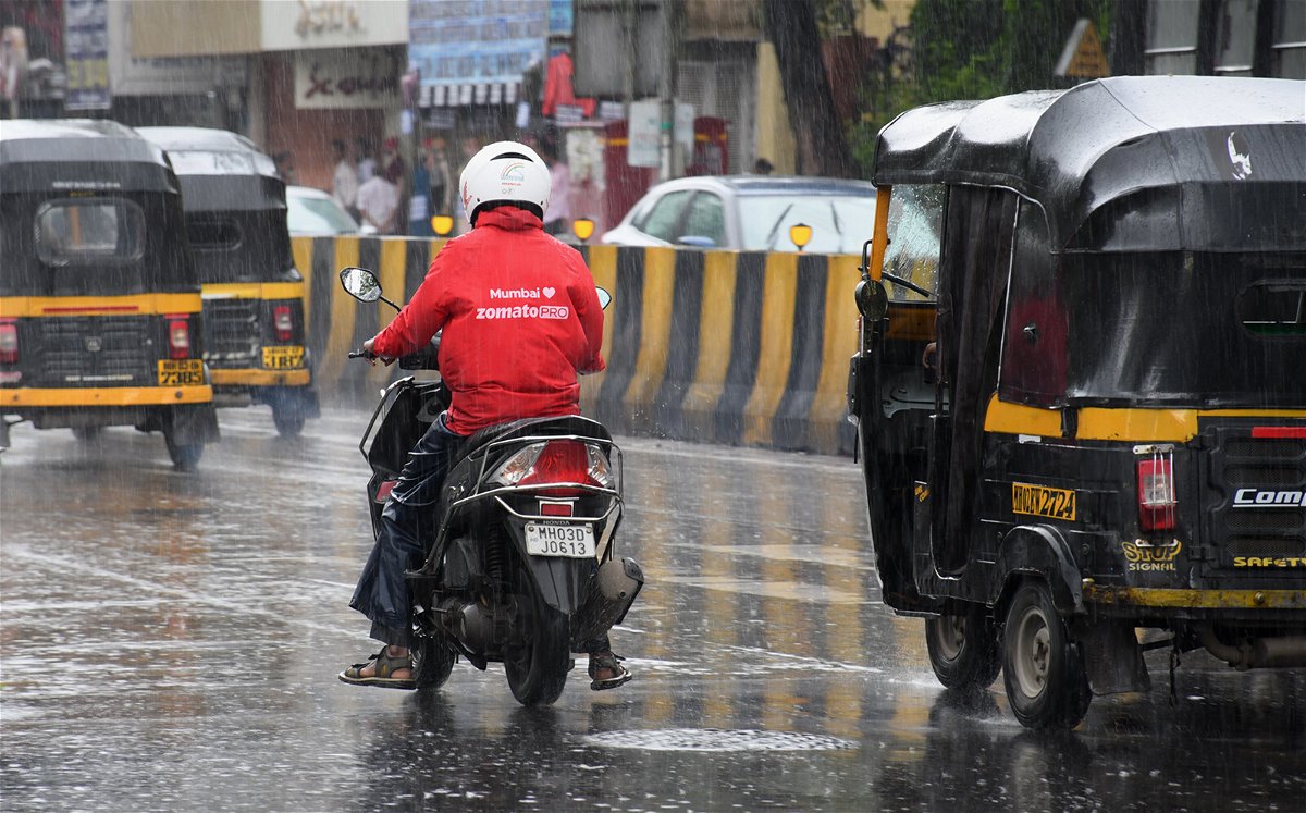 <i>Ashish Vaishnav/SOPA Images/Sipa</i><br/>A Zomato delivery man is seen riding along the streets of Mumbai. Shares in Zomato gained about 80% on their first day of trading on Mumbai's stock exchange.