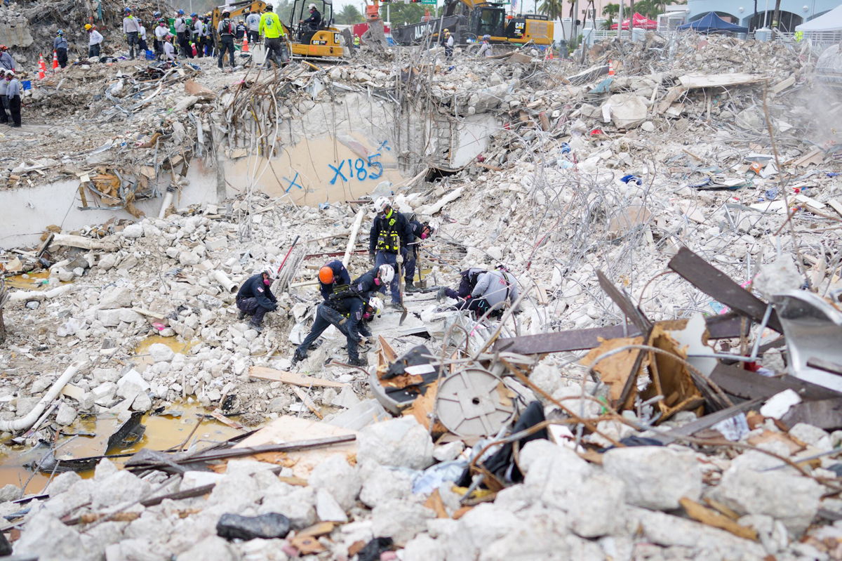 <i>Miami-Dade Fire Rescue/Twitter</i><br/>Task force members working at the residential building collapse site in Miami-Dade County