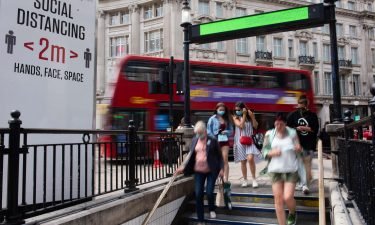 People walk into Oxford Circus Underground Station. Using public transportation again is one of the activities Brits are most anxious about