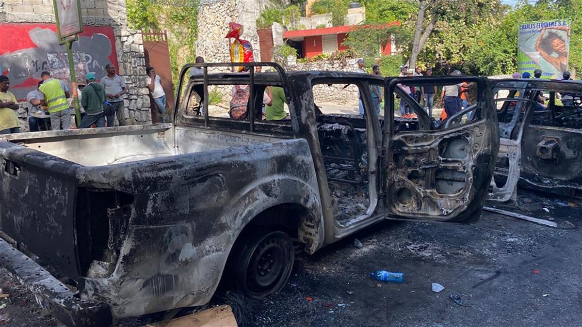 <i>Caitlin Hu/CNN</i><br/>Burned-out cars can be seen where the police engaged in a gun battle with the suspected assassins near Haiti's national palace on Route de Kenschoff.