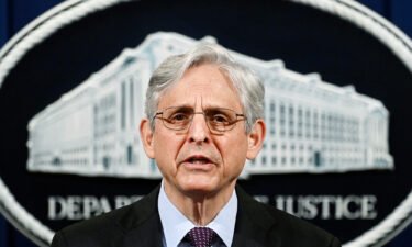 Attorney General Merrick Garland speaks at the Department of Justice in Washington on April 26. A proposed $30 billion insurance industry merger is off