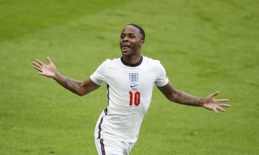Raheem Sterling celebrates after scoring England's opening goal of the game