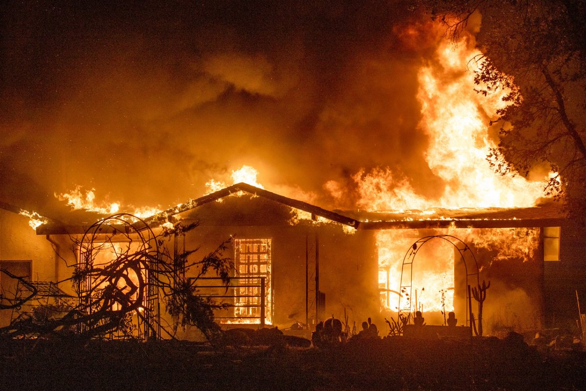 <i>Ethan Swope/AP</i><br/>A house burns on Platina Road at the Zogg Fire near Ono