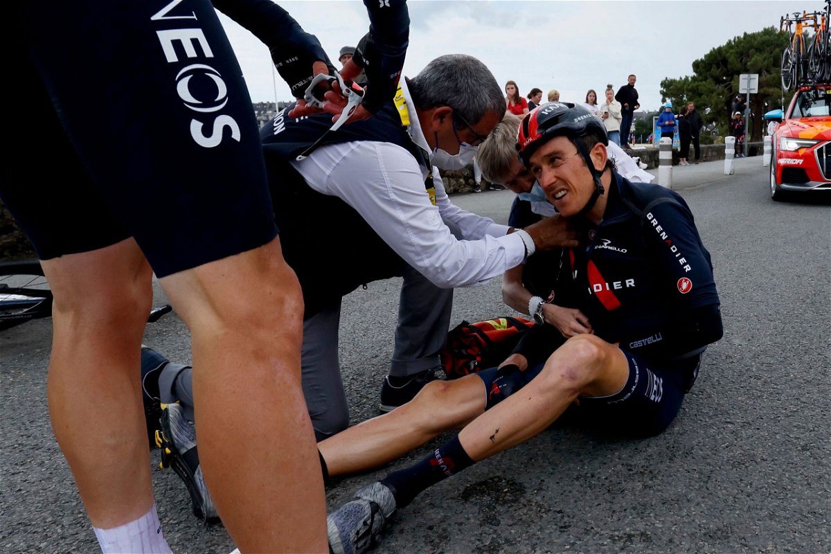 <i>Thomas Samson/AFP/Getty Images</i><br/>Geraint Thomas sits on the road after crashing during the third stage of the 108th edition of the Tour de France cycling race