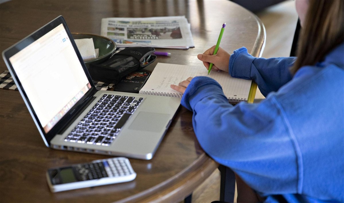 <i>Daniel Acker/Bloomberg/Getty Images</i><br/>A high school student works on an assignment on a laptop computer at home during a remote learning day in Tiskilwa