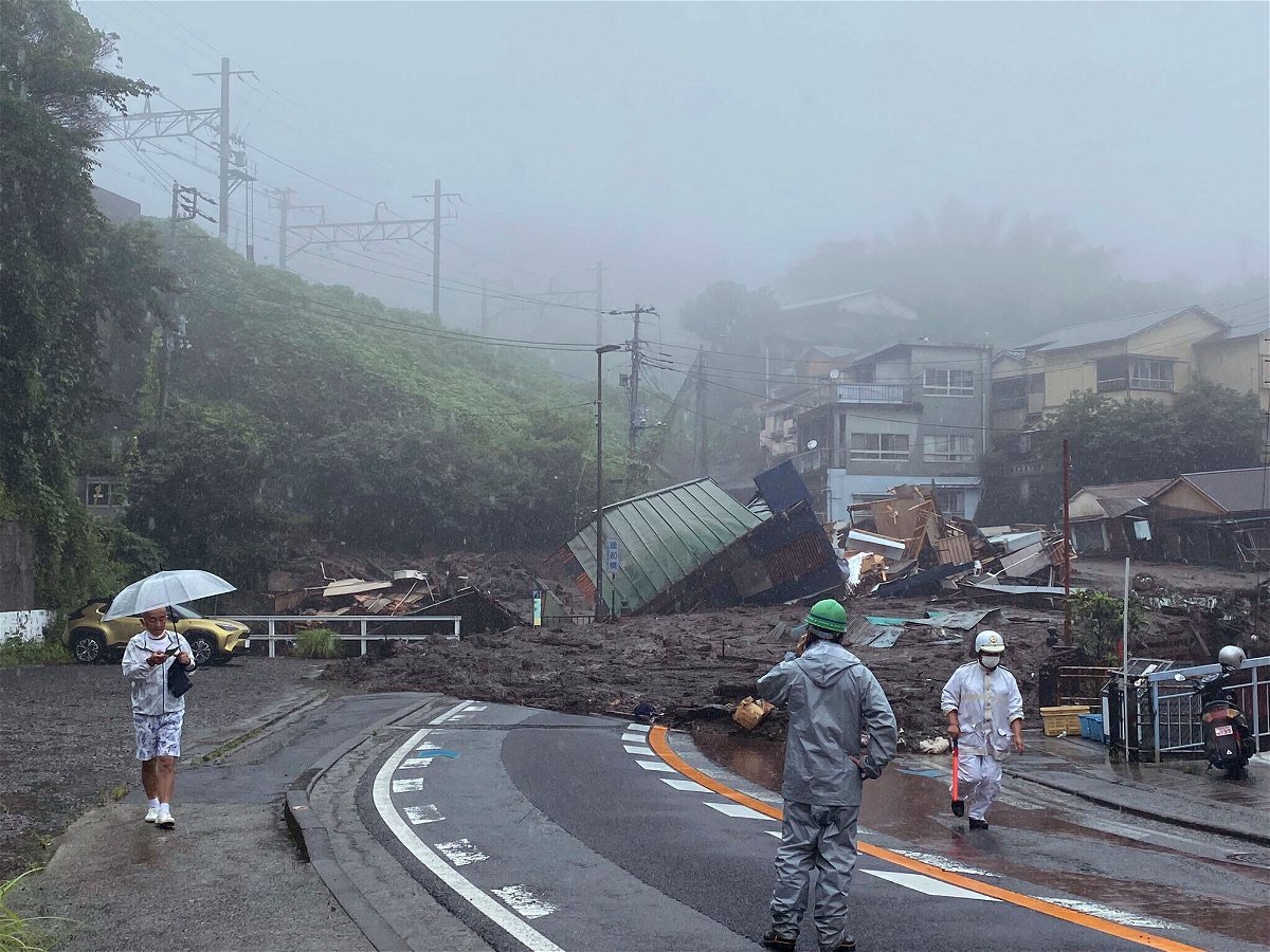 <i>AP</i><br/>A road is covered by mud and debris following heavy rain in Atami city