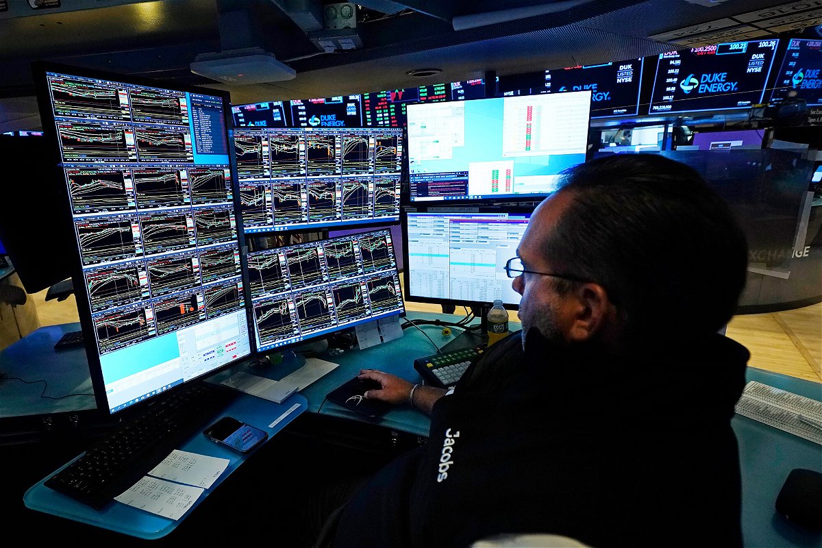 <i>Richard Drew/AP</i><br/>Specialist Anthony Matesic watches the screens at his post on the floor of the New York Stock Exchange