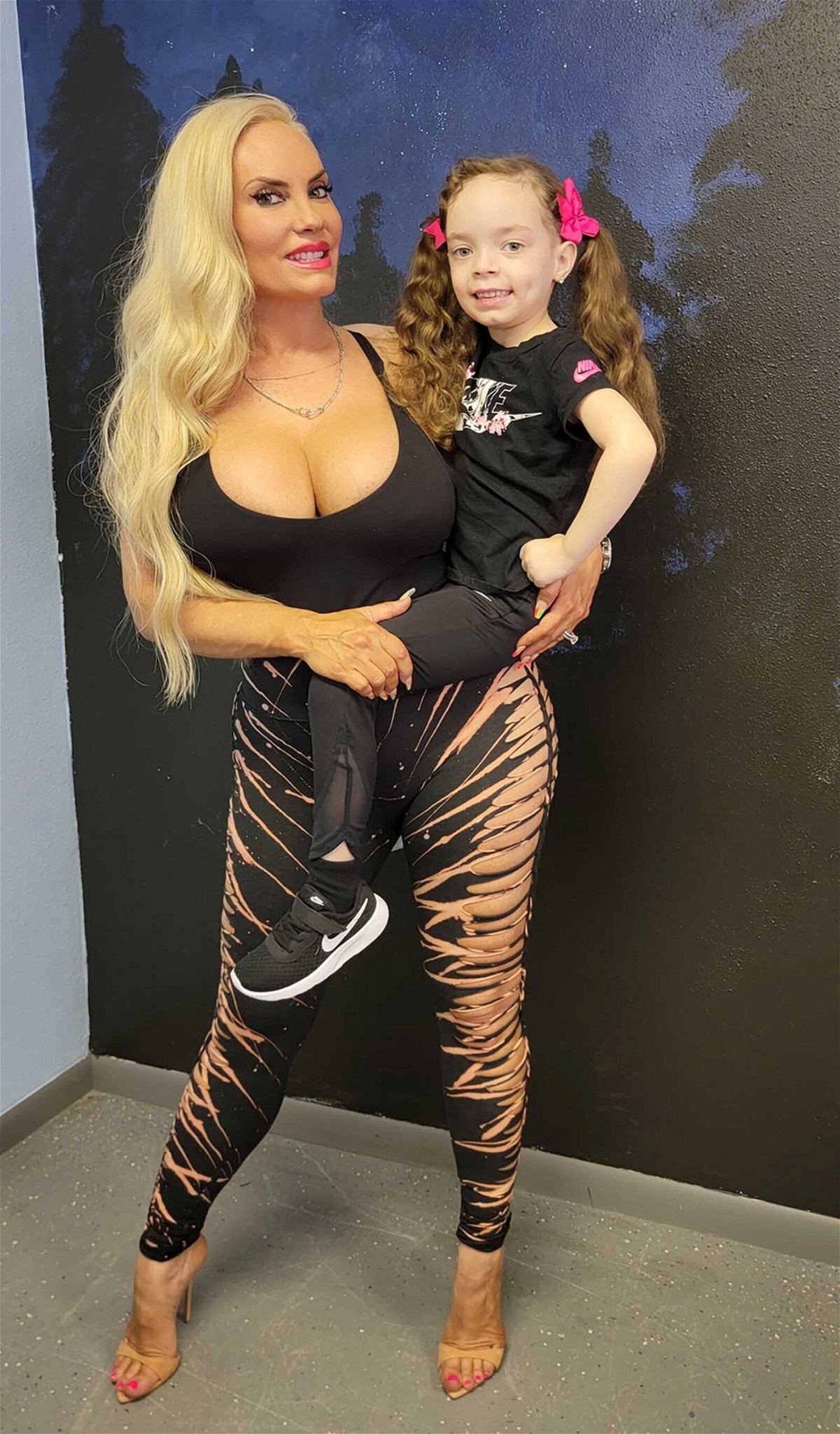 <i>From Baby Chanel Nicole/Twitter</i><br/>Coco Austin holds her daughter Chanel whose father is Austin's husband