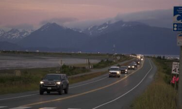 A line of cars evacuates the Homer Spit in Homer