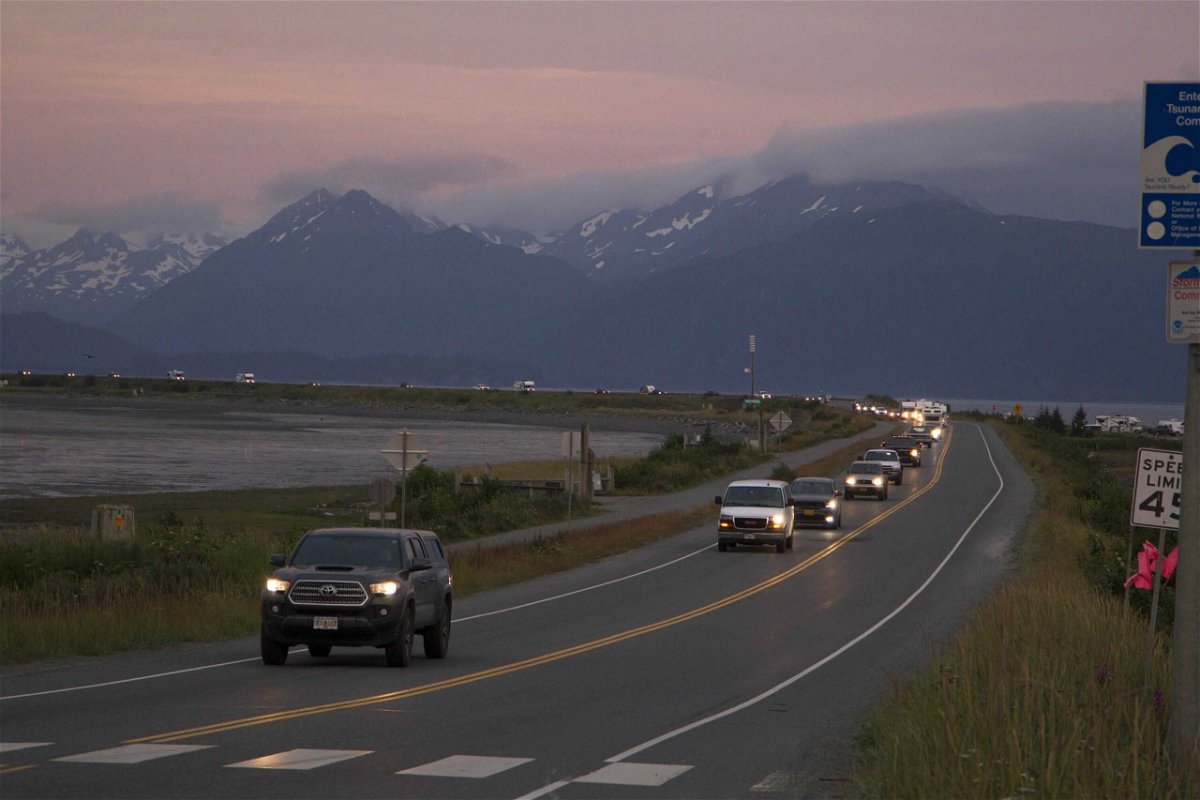 A line of cars evacuates the Homer Spit in Homer