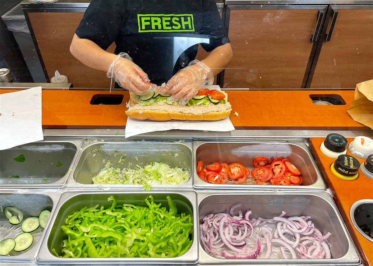 <i>Justin Sullivan/Getty Images</i><br/>A worker at a Subway sandwich shop makes a tuna sandwich on June 22 in San Anselmo