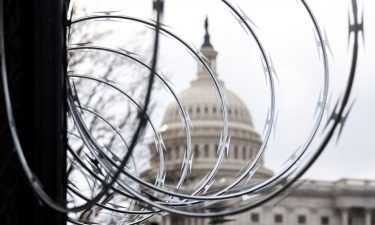 Razor wire is seen on top of a security fence surrounding the US Capitol in Washington
