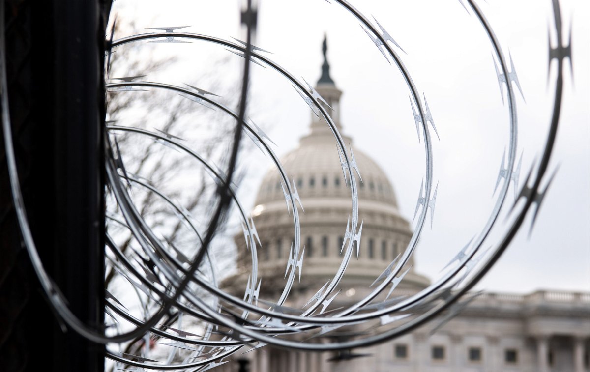 <i>Saul Loeb/AFP/Getty Images</i><br/>Razor wire is seen on top of a security fence surrounding the US Capitol in Washington