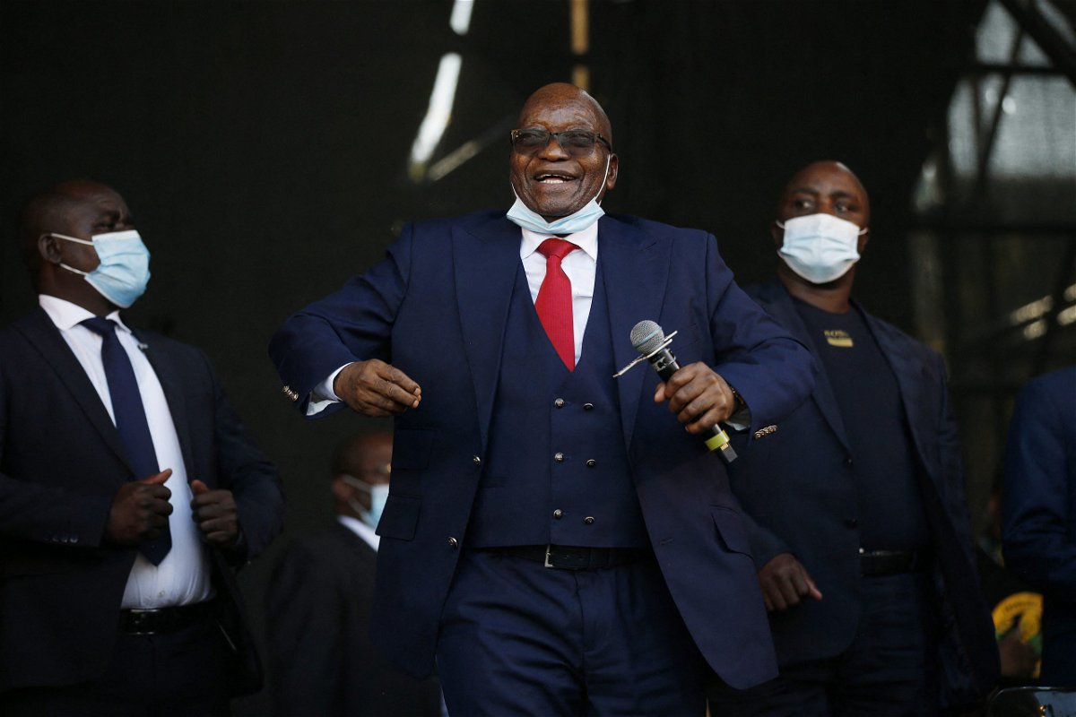 <i>Phil Magakoe/AFP via Getty Images</i><br/>Former South African President Jacob Zuma dances on stage before addressing his supporters following the postponement of his corruption trial outside the Pietermaritzburg High Court in Pietermaritzburg
