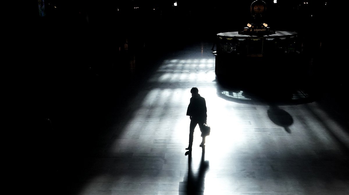 <i>Timothy A. Clary/AFP/Getty Images</i><br/>A commuter walks through Grand Central Terminal amid the coronavirus pandemic in New York City