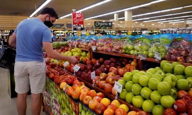 Customers shop for produce at a supermarket on June 10 in Chicago