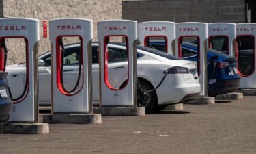 Tesla vehicles at charging stations outside a store in Rocklin
