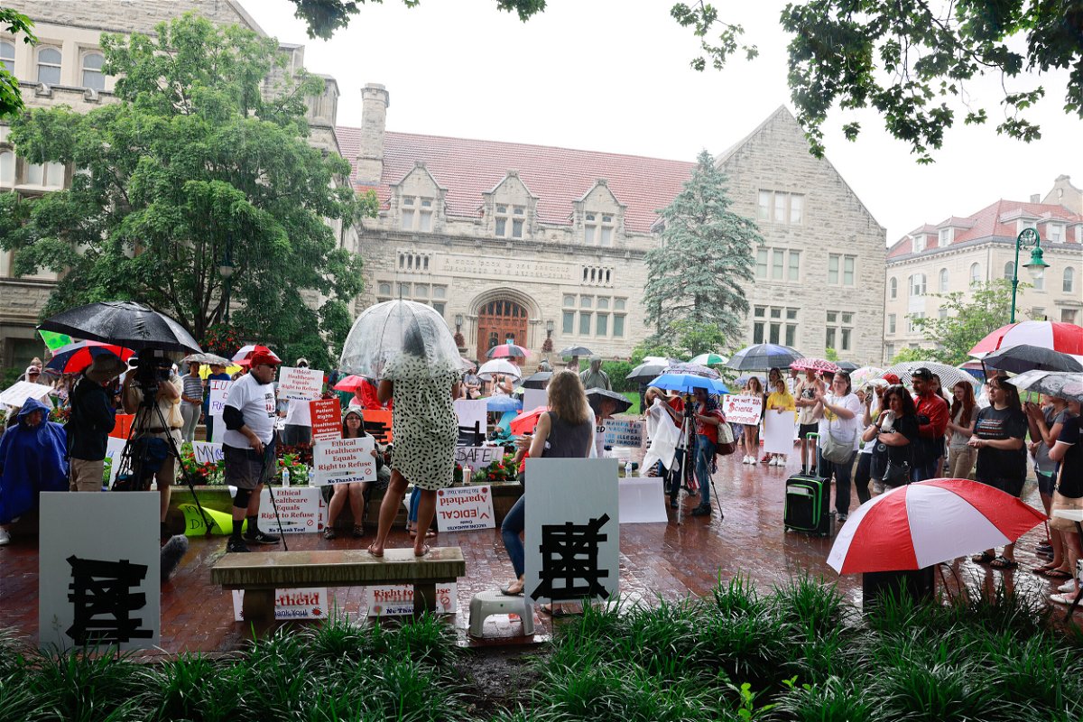 <i>Jeremy Hogan/SOPA Images/Sipa USA</i><br/>Anti-vaxxers and anti-maskers gathered at Indiana University's Sample Gates to protest against mandatory Covid-19 vaccinations IU is requiring for students