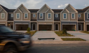 "Sold" signs in the windows of new townhomes in the Hunter's Crossing subdivision in Sumter