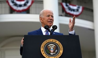 US President Joe Biden gestures as he speaks on the South Lawn of the White House in Washington