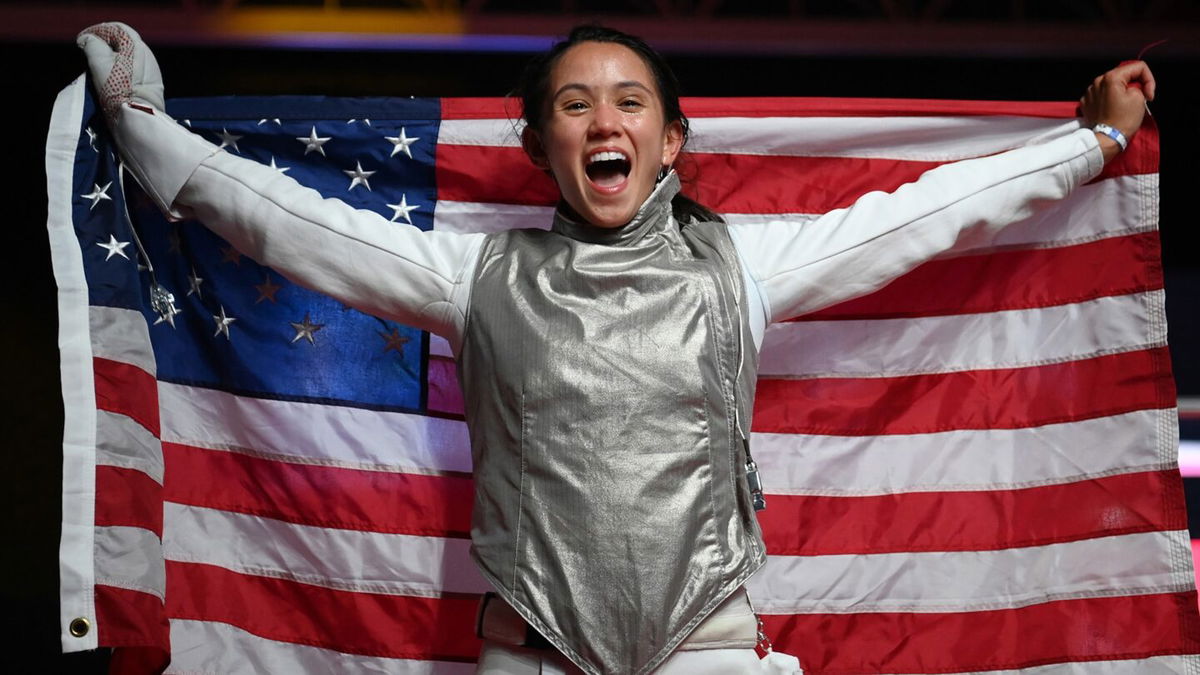 Lee Kiefer celebrates winning a gold medal in women's individual foil