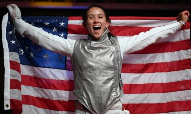 Lee Kiefer celebrates winning a gold medal in women's individual foil