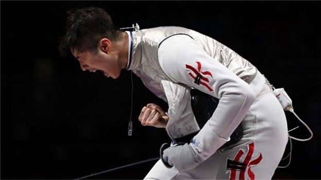 Cheung Ka Long celebrates winning a fencing bout a the Tokyo Olympics