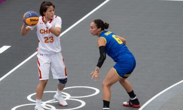 China knocks off Romania with game-winning shot